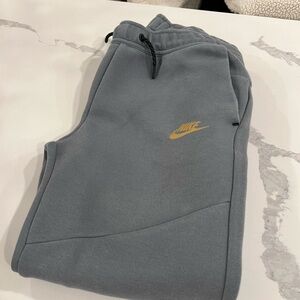 Nike Gray Joggers with Gold Swoosh